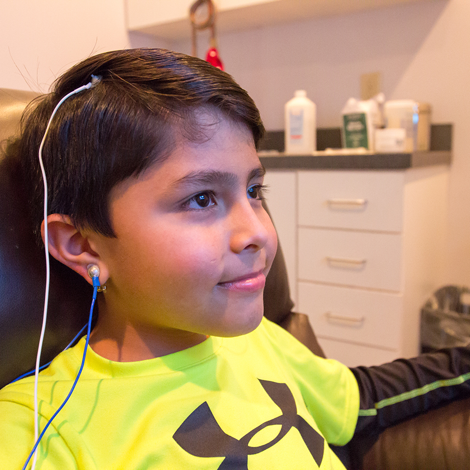 Young boy participates in Neurofeedback therapy